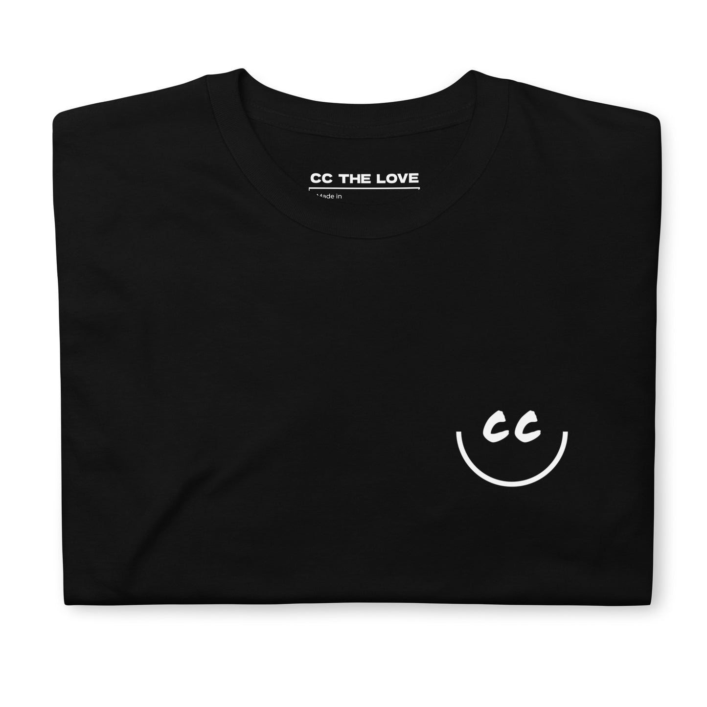 Black t-shirt with 'Smile' in white text, on heart