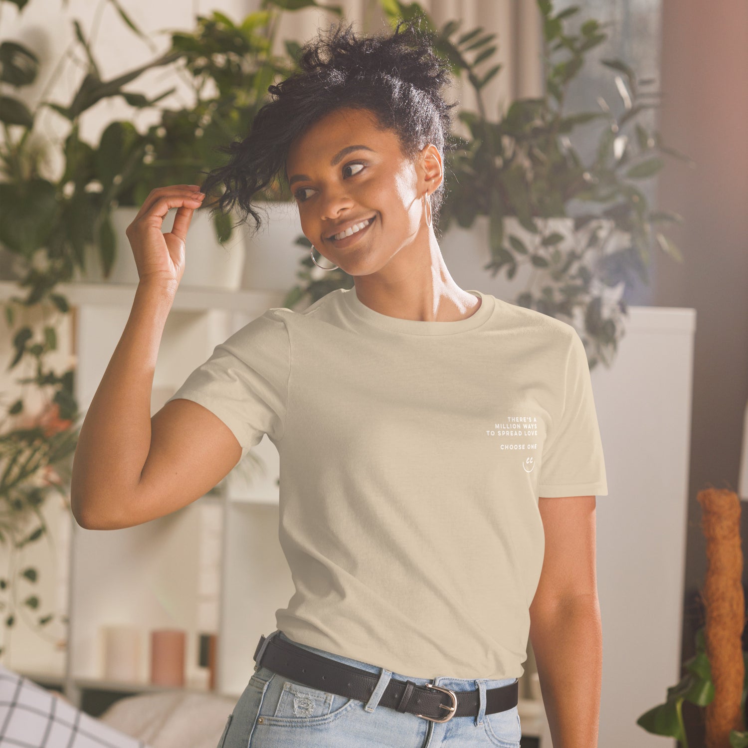 Woman wearing Million Smiles T-Shirt with plants in background