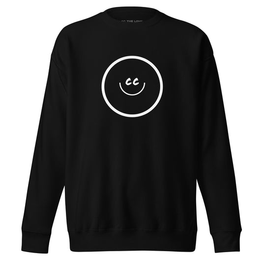 El Primer black premium unisex sweatshirt featuring the signature CC THE LOVE smile design.