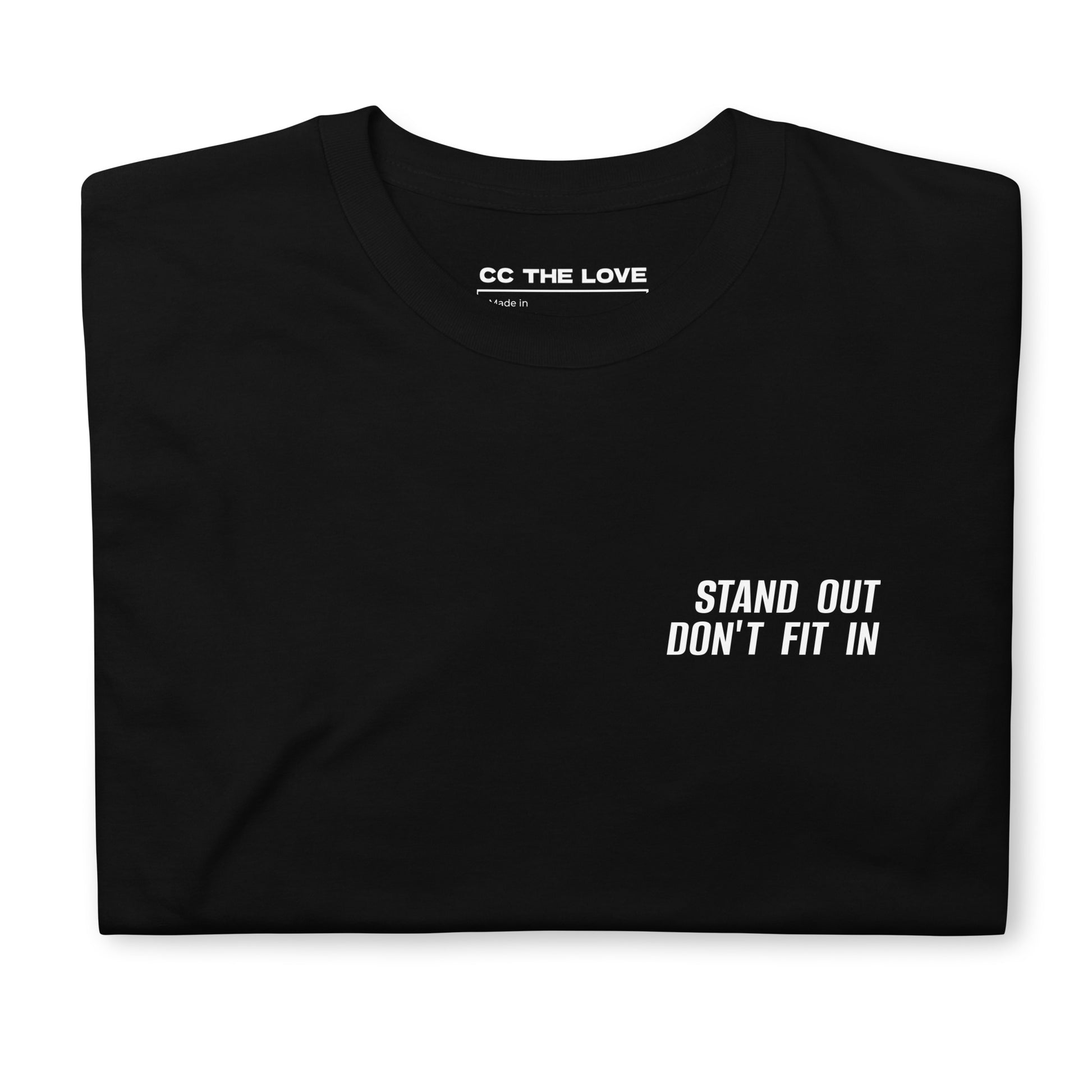 Black t-shirt with 'Stand Out. Don’t Fit In' in white bold font
