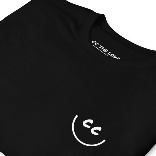 Black t-shirt with 'Smile' in white text, on heart
