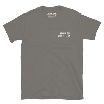 Charcoal t-shirt with 'Stand Out. Don't Fit In' in white text, minimalist design on chest.