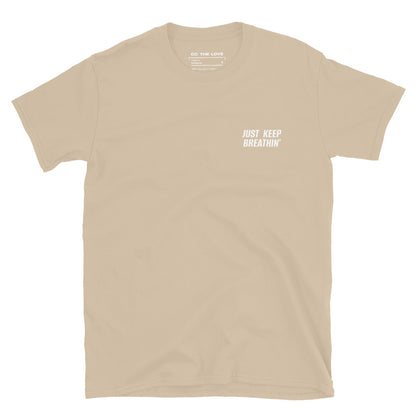 Sand t-shirt with 'Just Keep Breathin'' in white text, minimalist design on chest